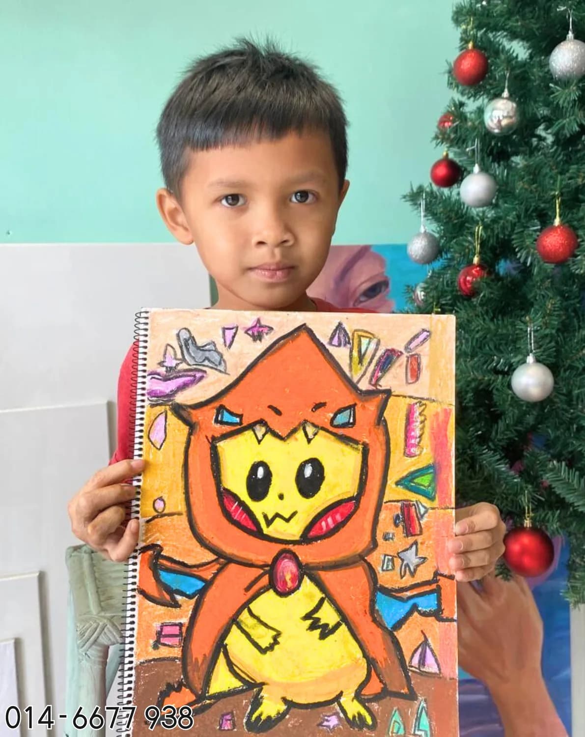 Boy holding cat character painting from Rycca kids painting class